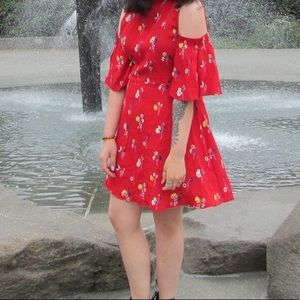 Red cold shoulder dress with multi color floral.